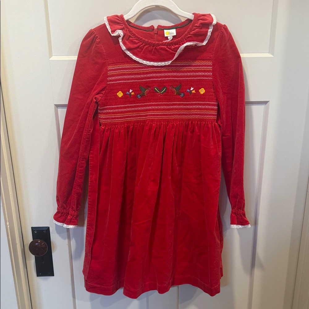 Gorgeous smocked Mini Boden dress with delicate lace detail. NWT